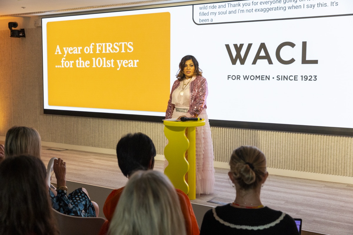 Nishma speaking at a podium